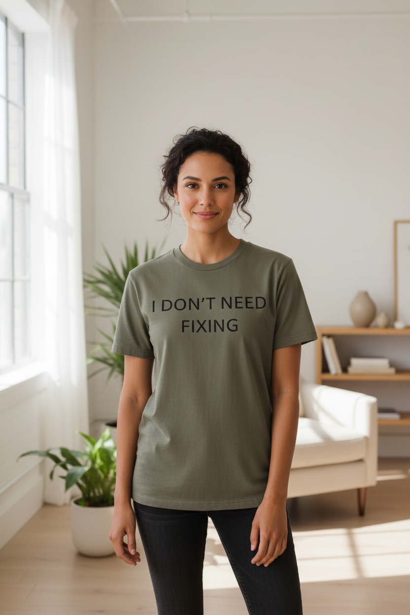 Woman wearing I Don't Need Fixing neurodivergent tee indoors